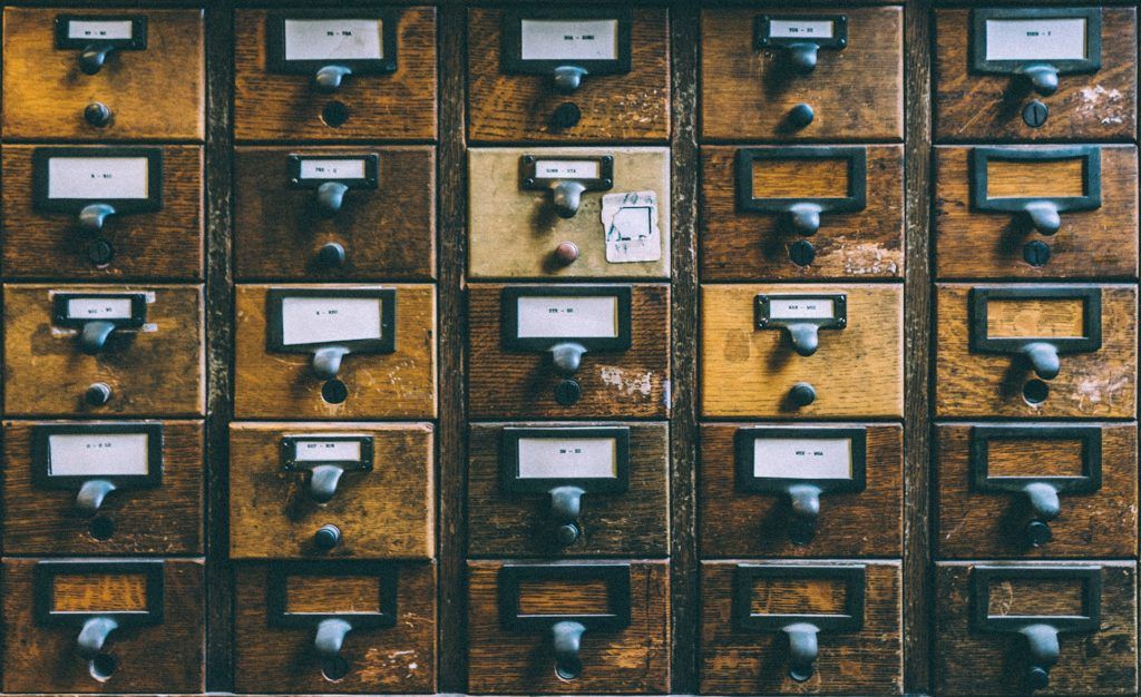 vintage wooden filing cabinet exuding organized nostalgia and charm in a grid pattern.