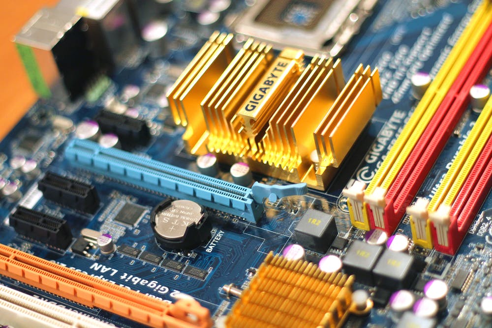 close-up of a high-tech motherboard with colorful components, showcasing modern computer hardware design.