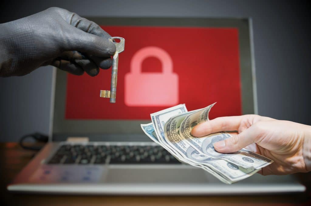 cyber extortion: key for cash transaction with locked laptop.