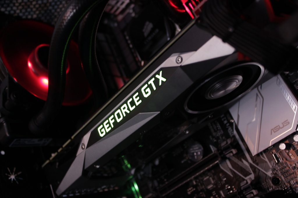 sleek geforce gtx graphics card in modern gaming setup with rgb lighting for aesthetics.