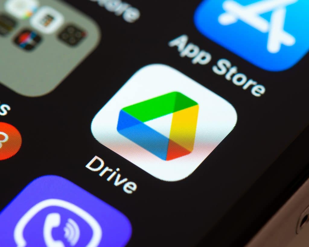 modern smartphone screen with google drive and app store icons for digital file management.