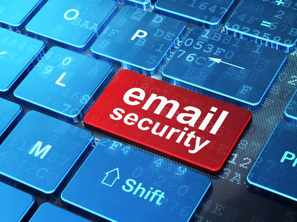 secure email: modern keyboard with red key, emphasizing cybersecurity in digital era.