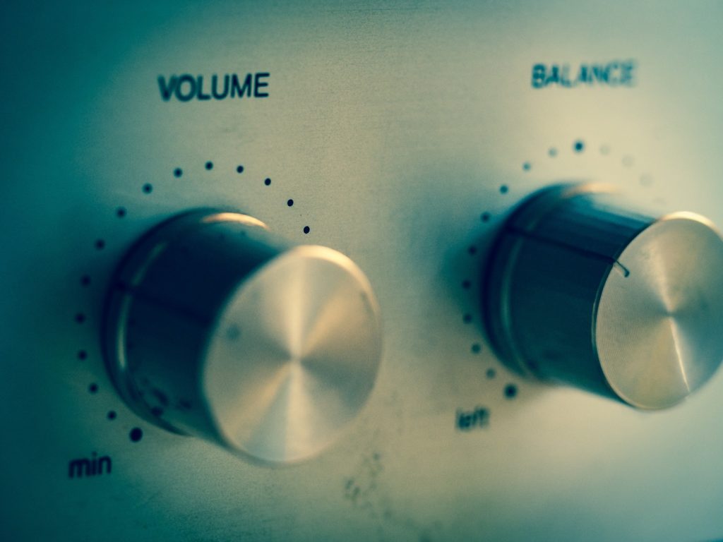 classic audio control knobs: volume and balance for precise sound adjustment.