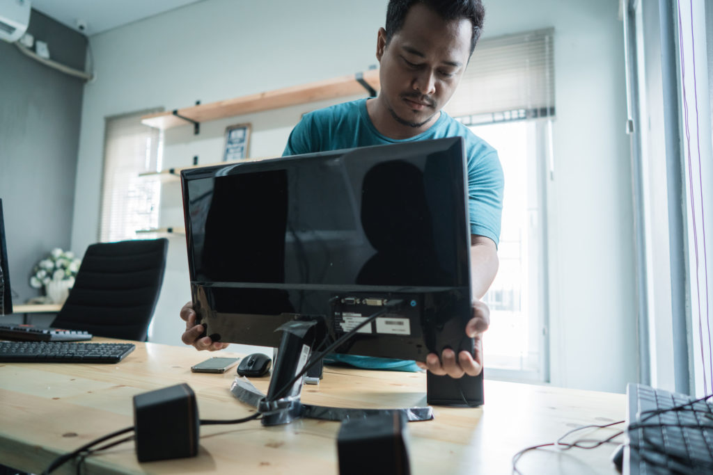 technician installing new hardware in modern office environment.