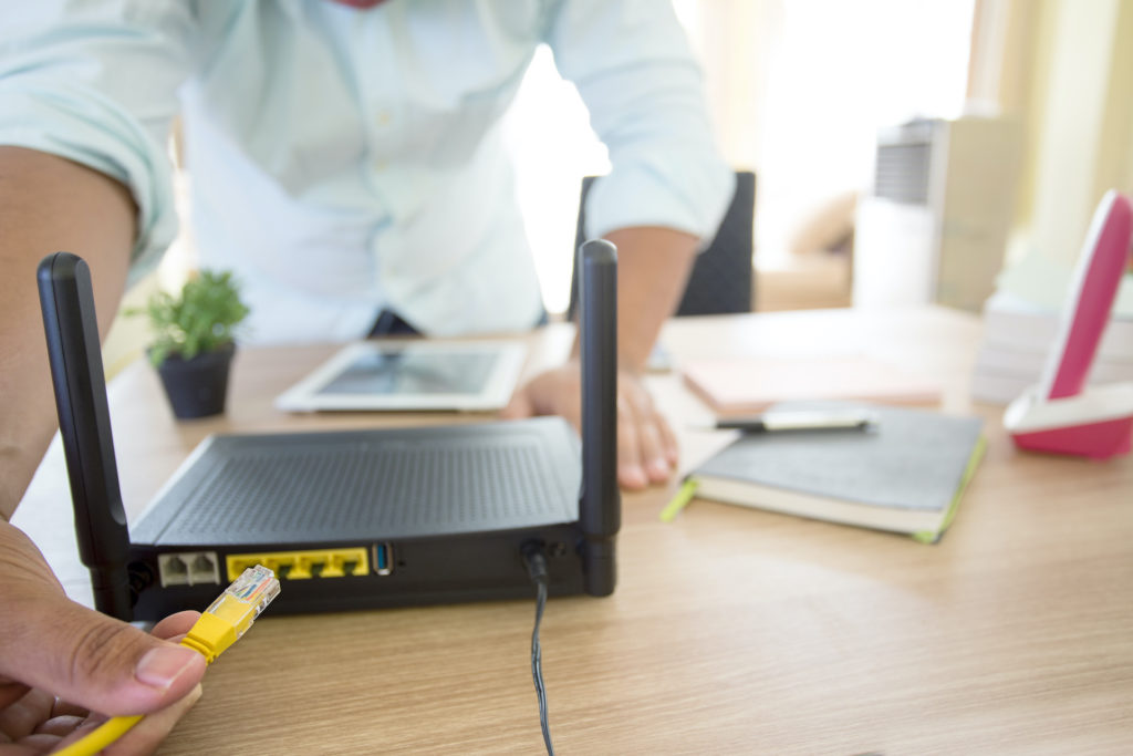 enhancing connectivity in modern offices with lan cable and wireless router setup.