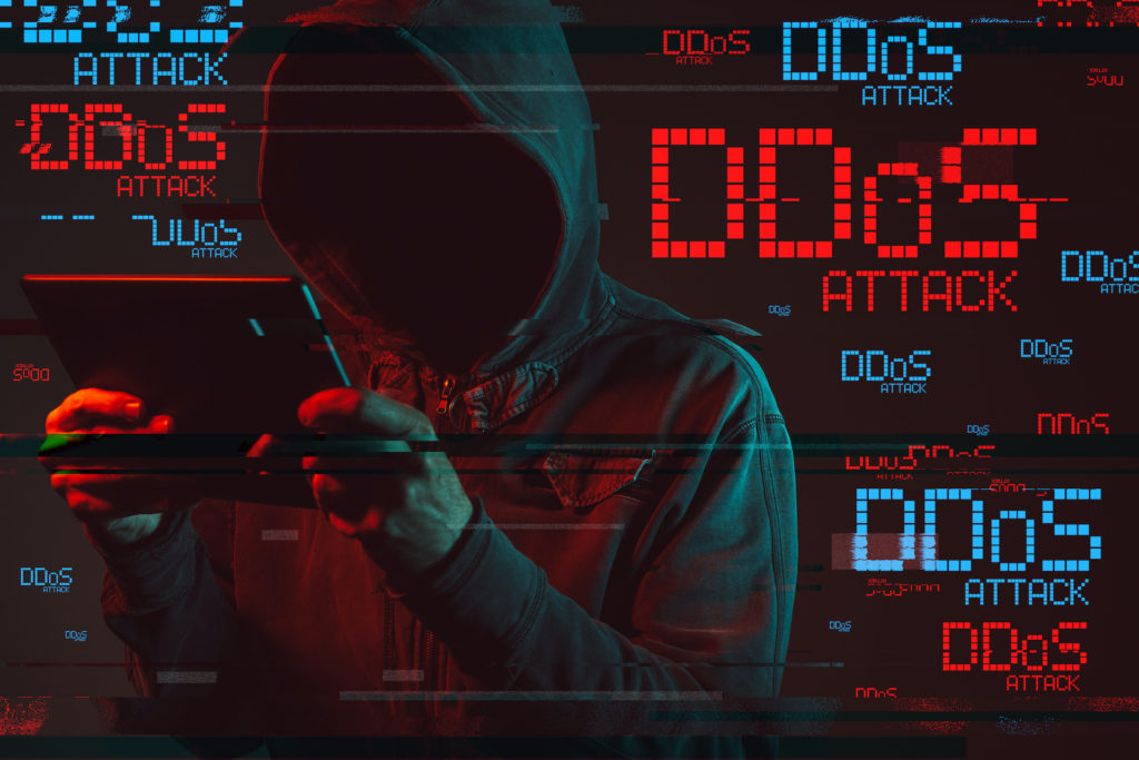 unveiling the threat: faceless figure orchestrates ddos attack with glitch effects.