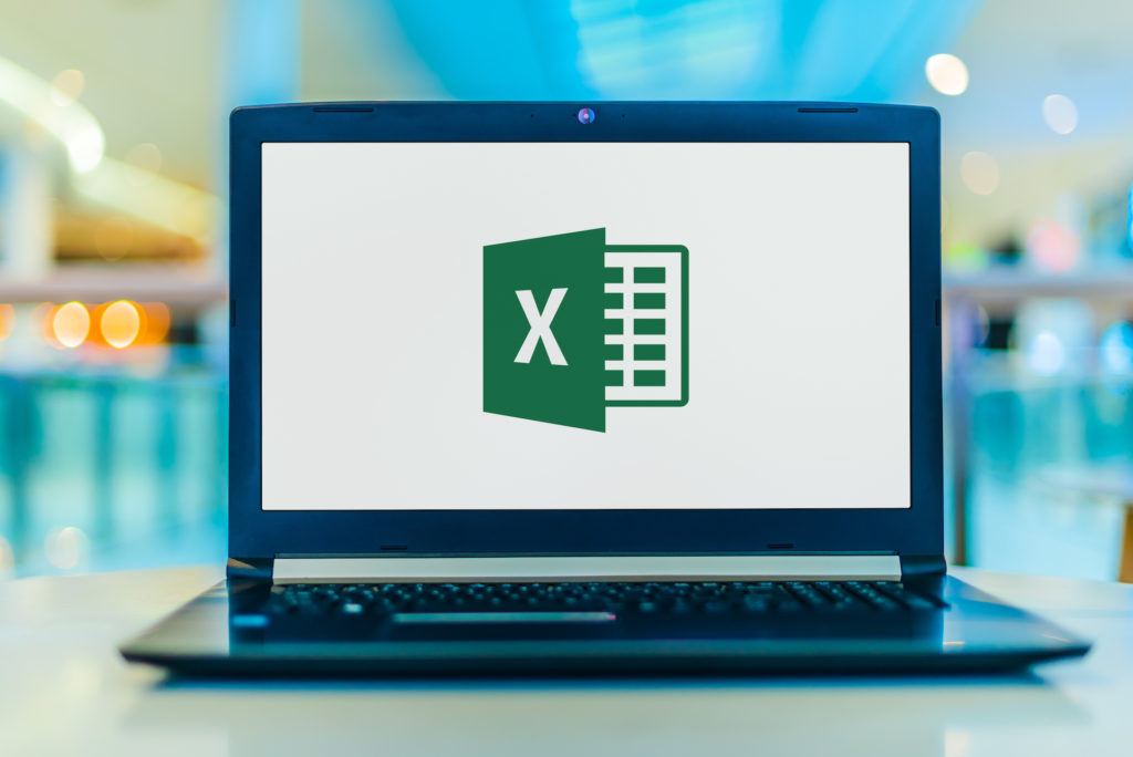 sleek laptop displaying microsoft excel logo in contemporary office setting.