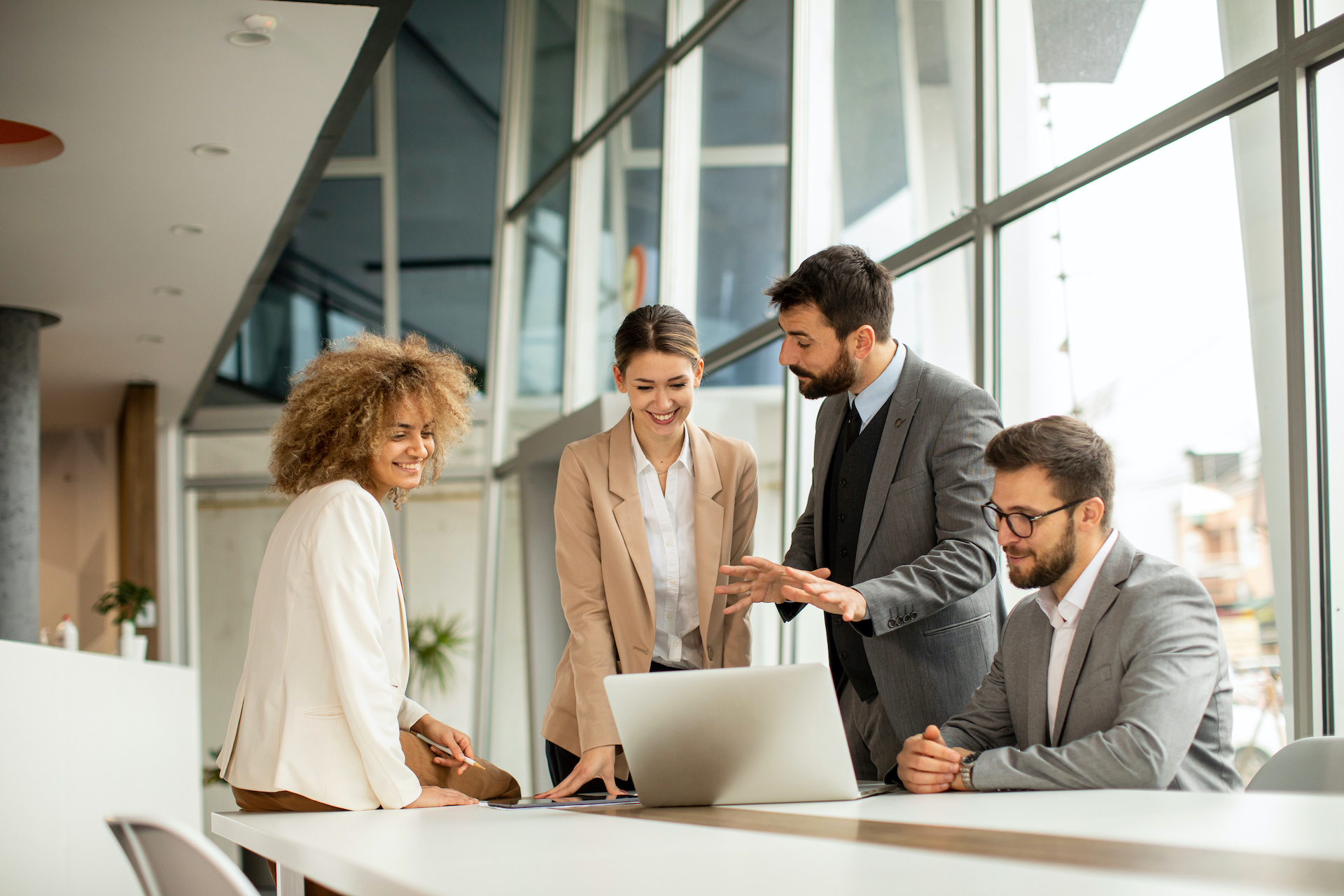 collaborative diverse professionals working together in modern office setting for effective teamwork.