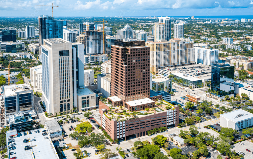 dynamic cityscape with modern architecture, green spaces, and ongoing construction in a bustling metropolis.