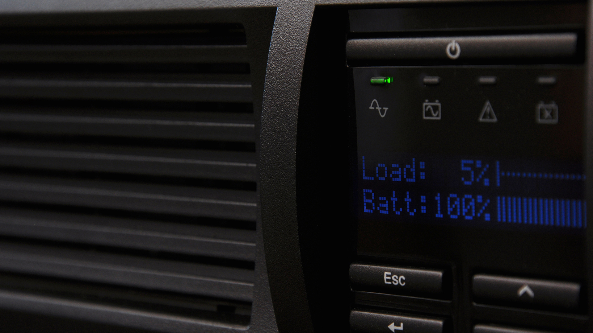 Sleek digital control panel displaying 5% load and 100% battery for efficient power management.