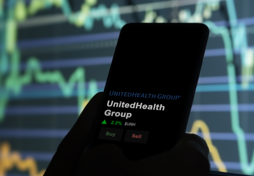 unitedhealth stock up 2.7% on vibrant smartphone graph background.