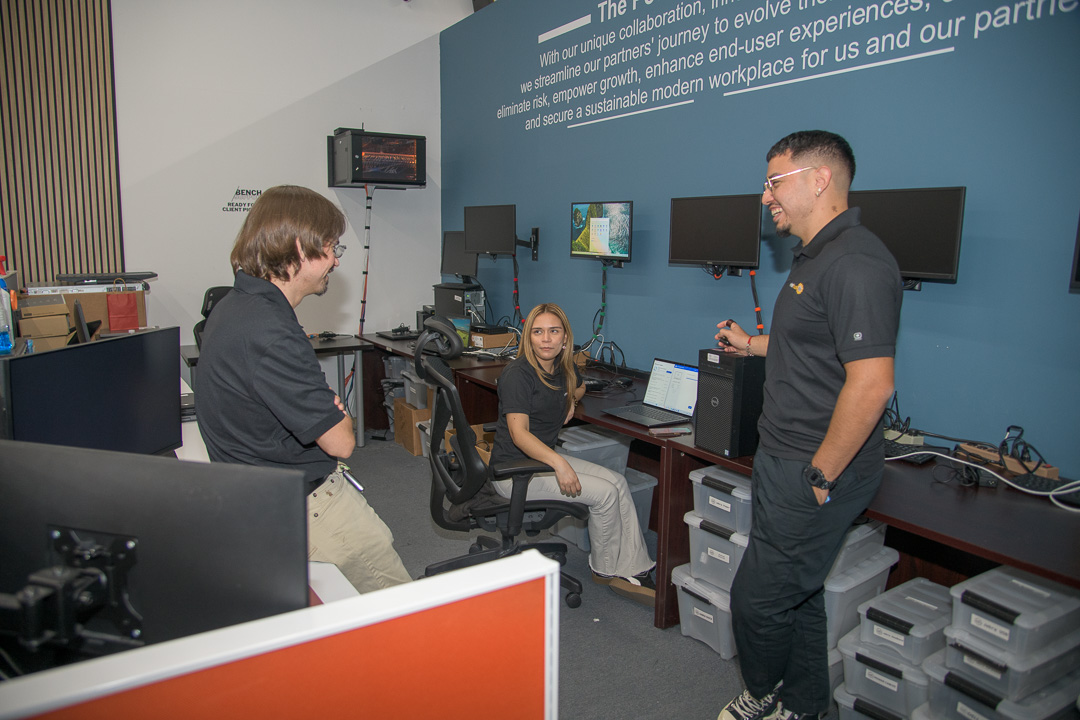 modern office environment promoting teamwork and innovation, featuring collaborative workspace and tech-savvy setup.