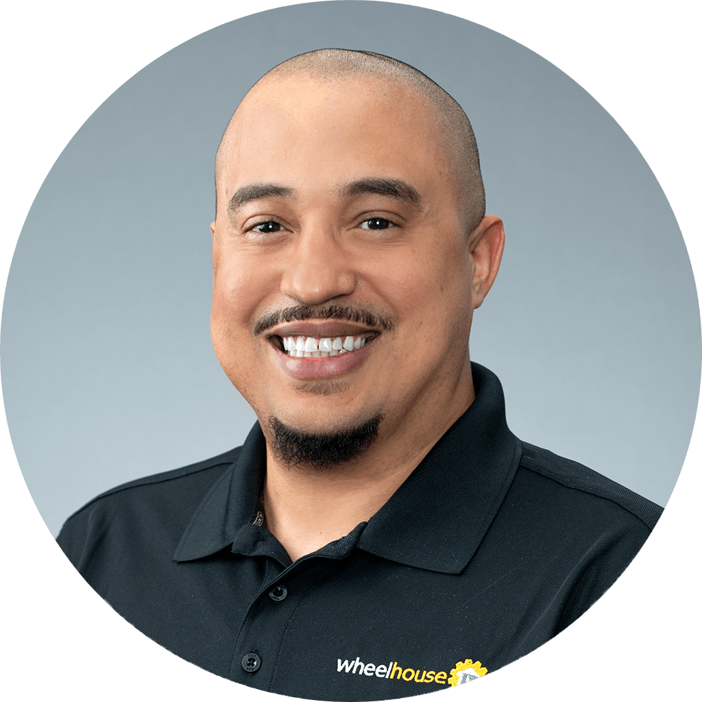 professional man with friendly smile in branded polo shirt for business portrait.