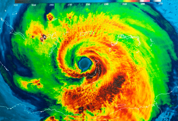 satellite view of florida hurricane with swirling bands of clouds, calm eye, and vibrant colors.